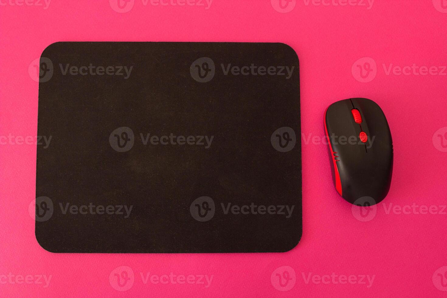 Computer mouse and mouse on a pink background photo