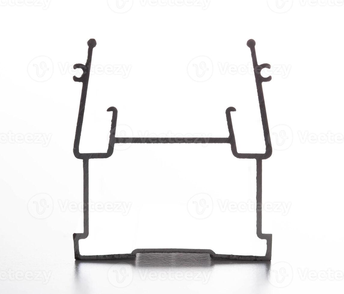 The material is an aluminum profile for the manufacture of windows and suspended ceilings. Close-up photo
