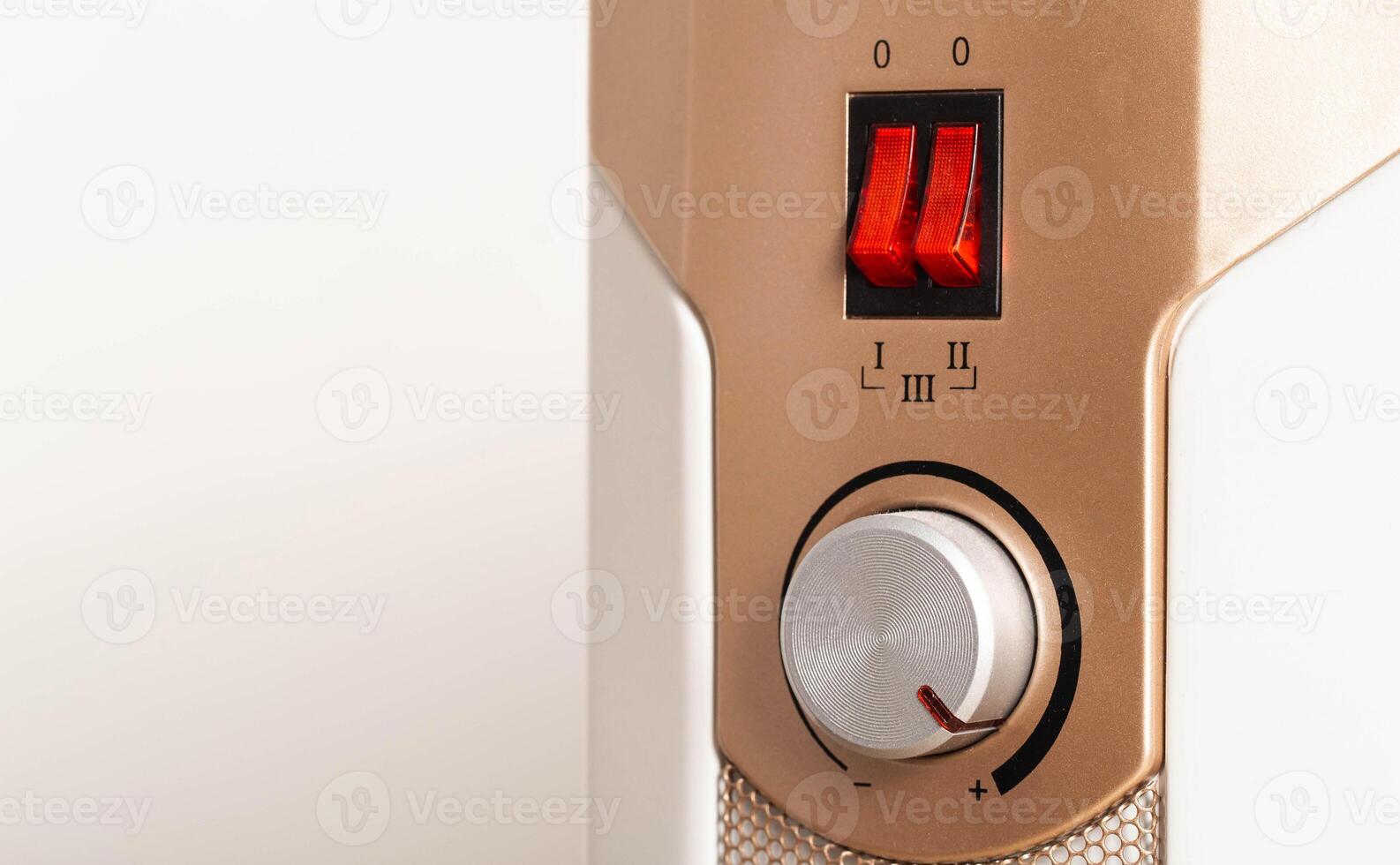 Electric oil heater with adjustable air heating temperature. Copy space for text, heat irradiation photo