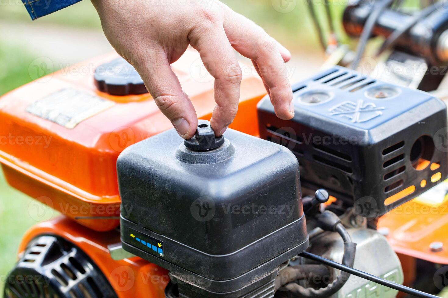 replacement of the air filter in the motoblock, service maintenance of agricultural machinery.Industry, walk-behind tractor photo