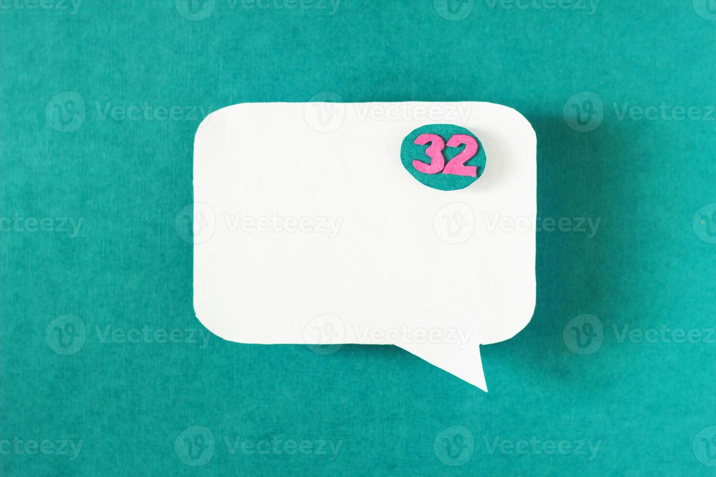 Symbol sign message from a white paper on a turquoise background, social network, message, symbol photo