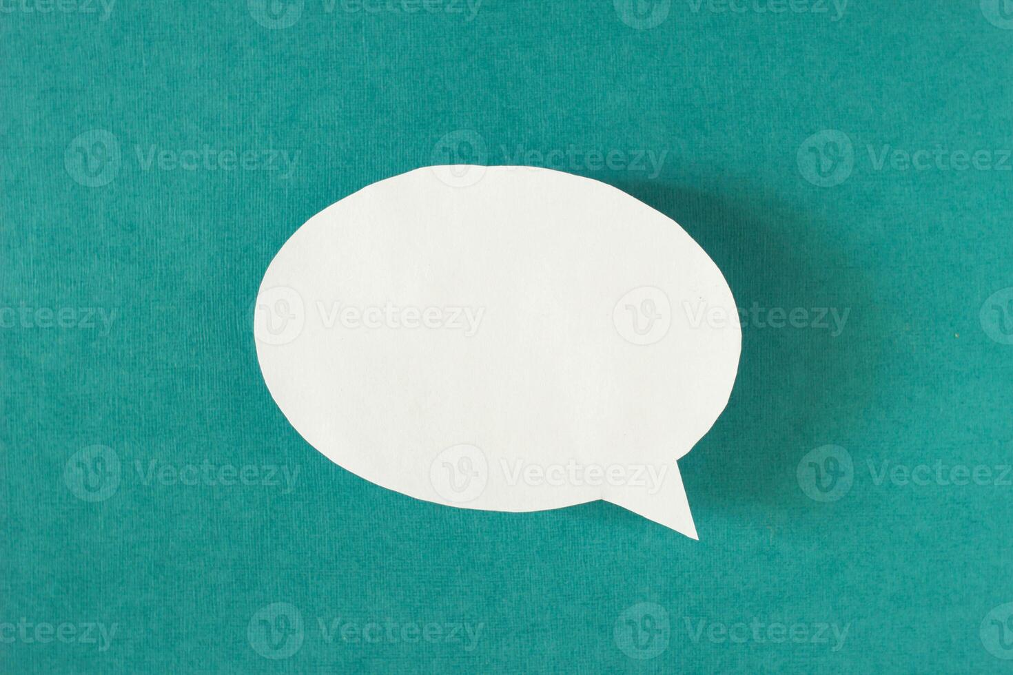 White bubble message from a paper on a turquoise background, social network, symbol photo
