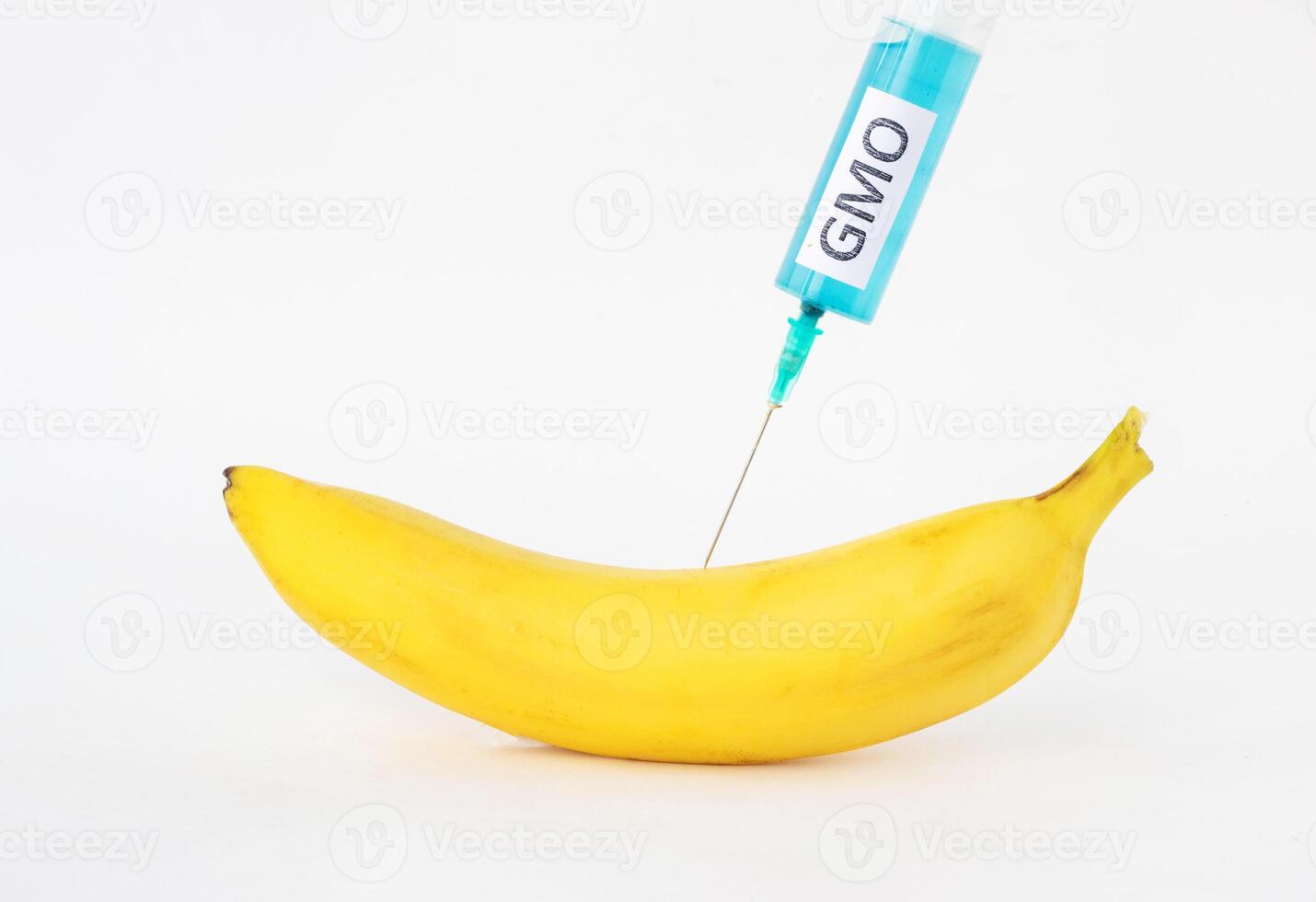 Banana on a white background in which gmo and nitrates are injected, close-up, genetically modified organism, nitrates photo