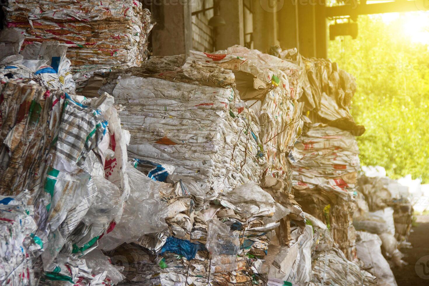 Pressed rubbish for further processing, sorting and processing of garbage and the sun photo