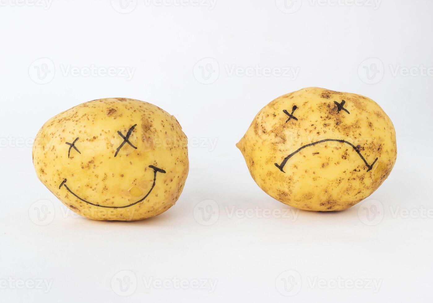 Potatoes on a white background with a cheerless and contented face with no gmo and nitrates and with nitrates, close-up, genetically modified organism, pratie photo