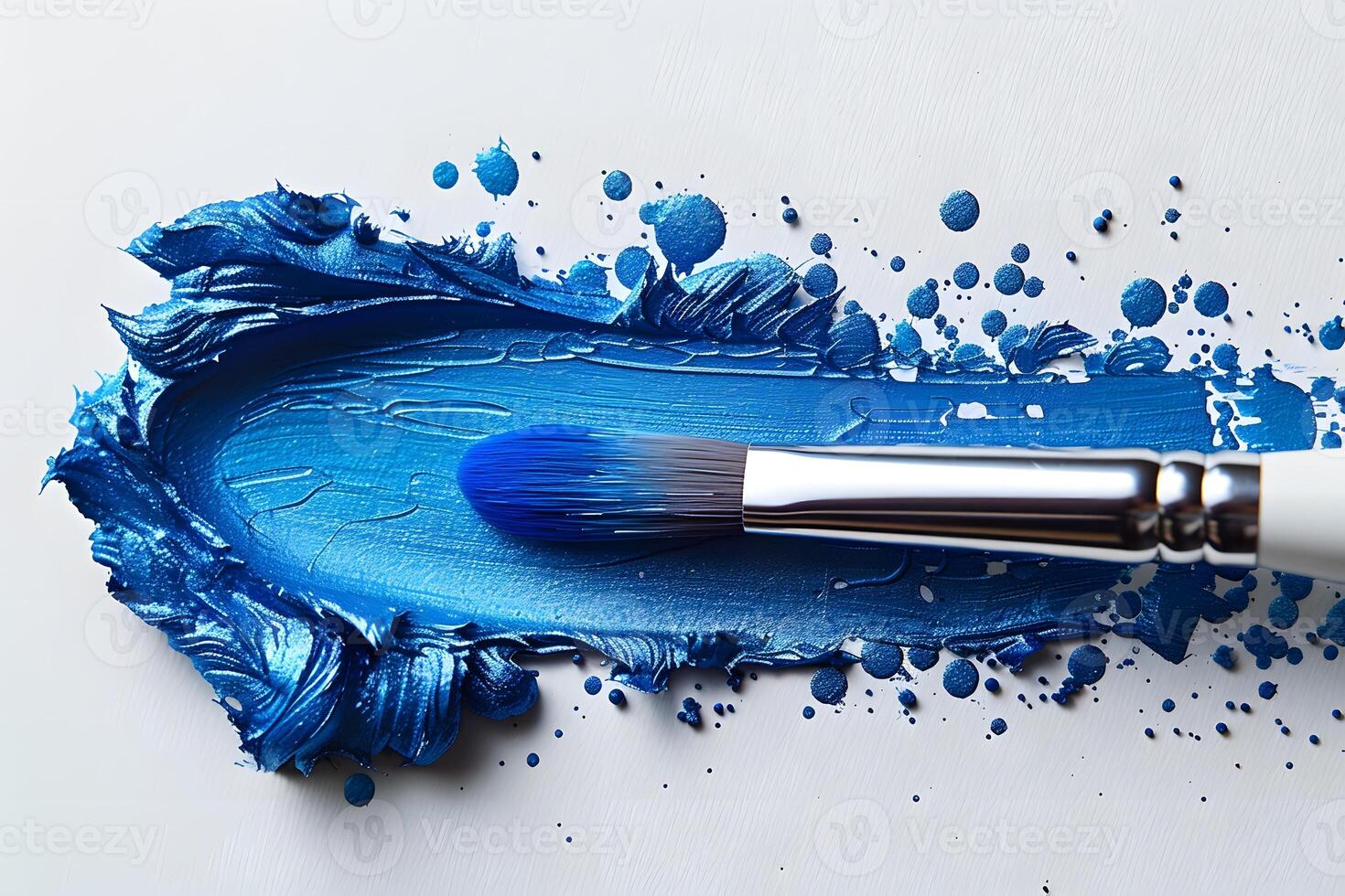 Dynamic Blue Brushstroke with Paintbrush on Canvas - Artistic Expression in Modern Art Design photo