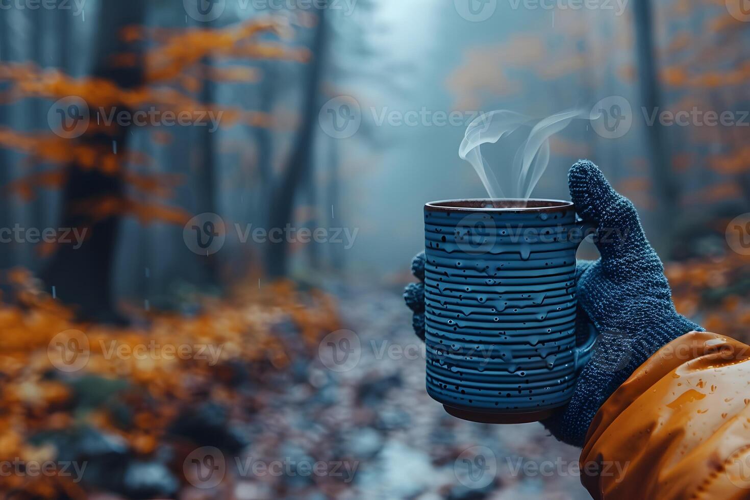 Cozy Autumn Walk with Warm Beverage in Misty Forest photo