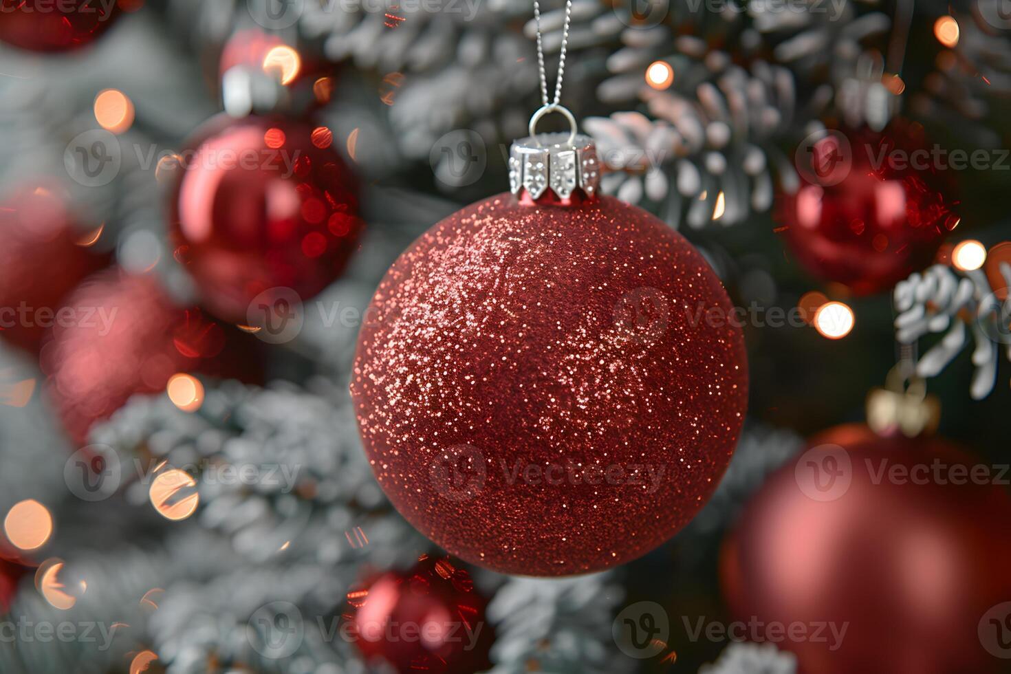Festive Christmas Ornament on Pine Tree with Glittering Red Baubles photo