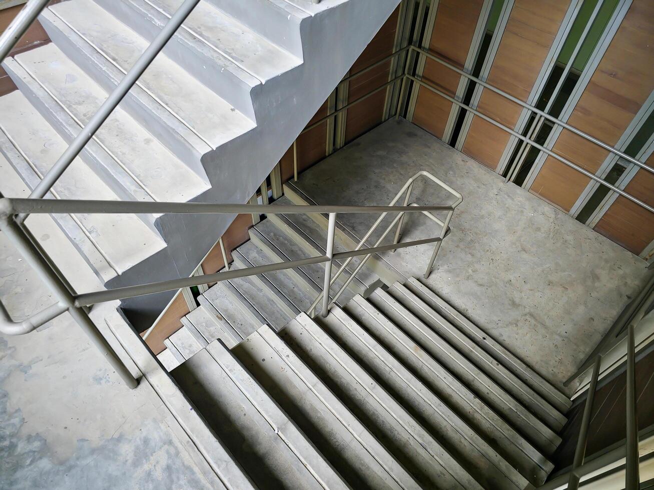 A fire escape or staircase in a tall urban building or apartment is essential evacuation in the event of a fire. photo