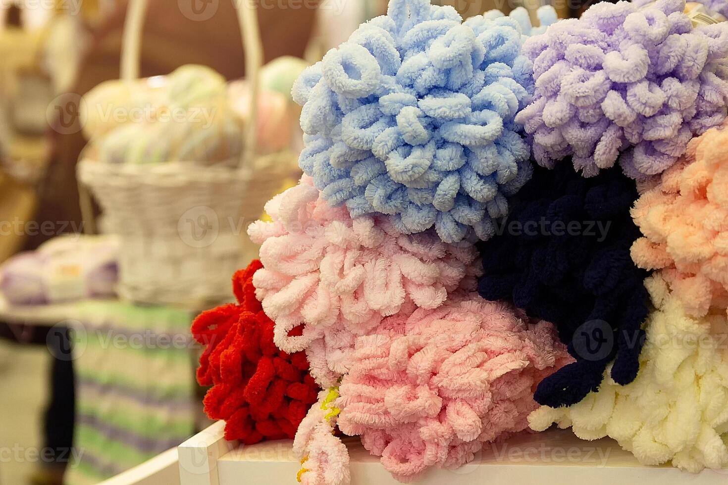 Colors wool balls on shop display stand for sale photo