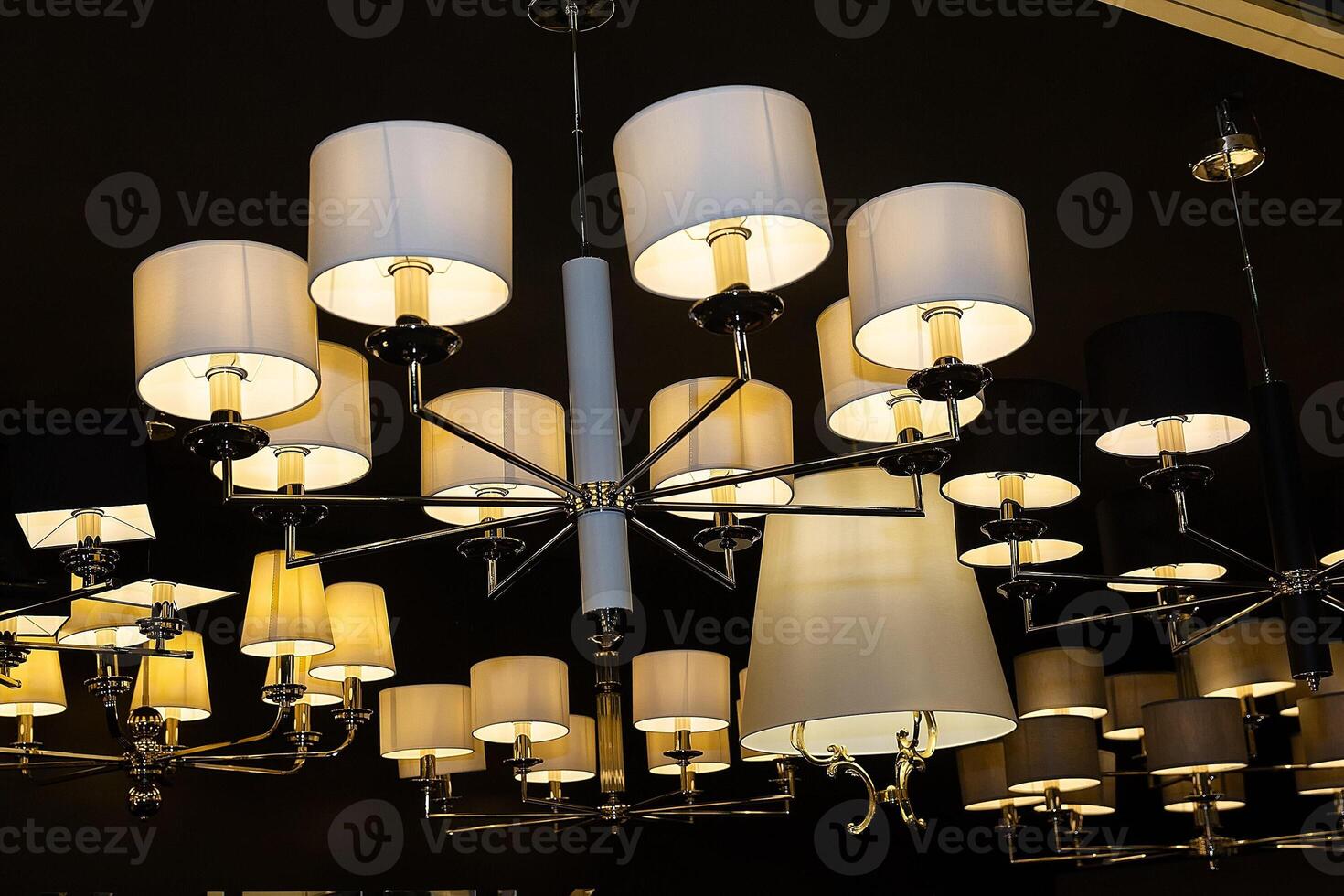 Modern elegance chandeliers in the store showroom photo