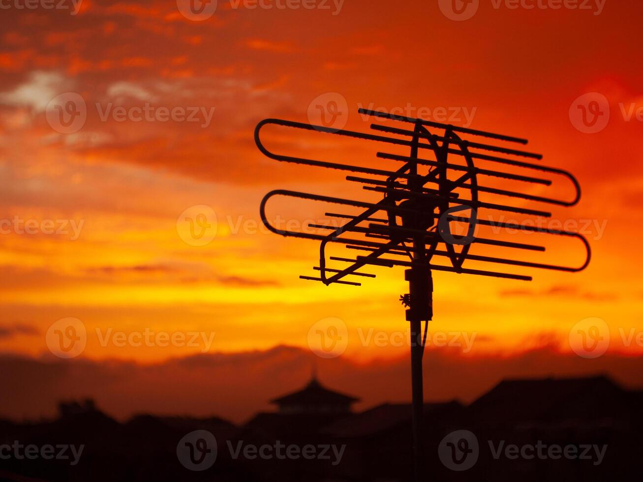 Antenna Silhouette Against a Bright Sunset. photo