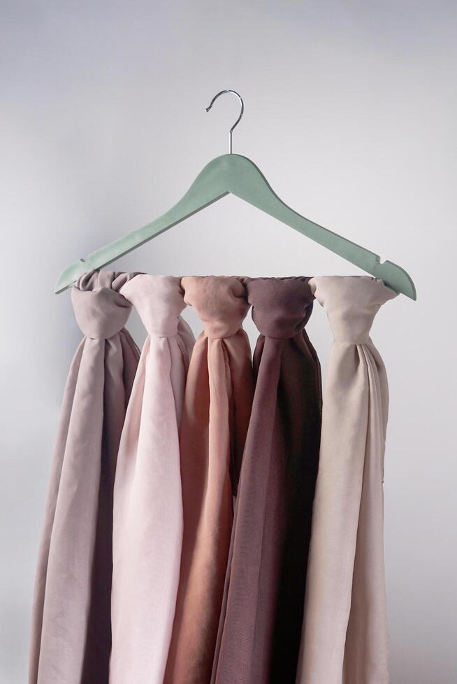 A soft colored hijab hanging in isolated on a white background. Hijab mockup and high resolution photos. photo