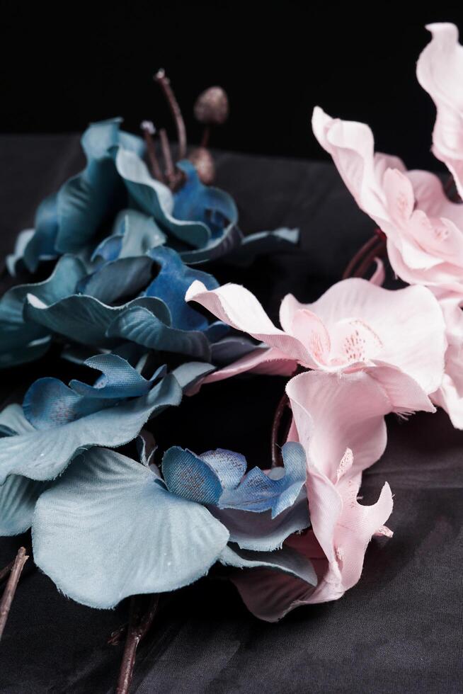 Pink and grey spring flowers on black background. High resolution photo. Selective focus. photo