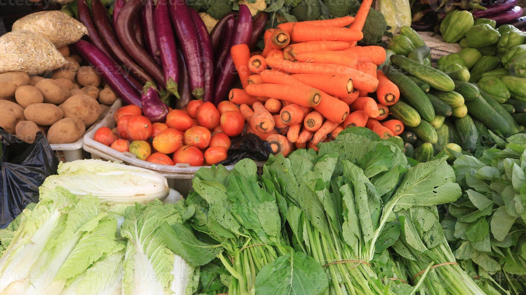 Beautifully arranged fresh vegetables at a javanese traditional market, for sale. photo