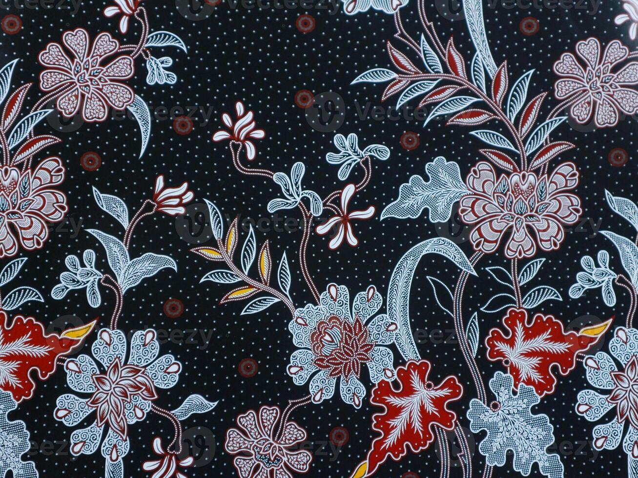 The beautiful black of art Indonesian Batik with floral pattern, leaf and flowers pattern fabric photo