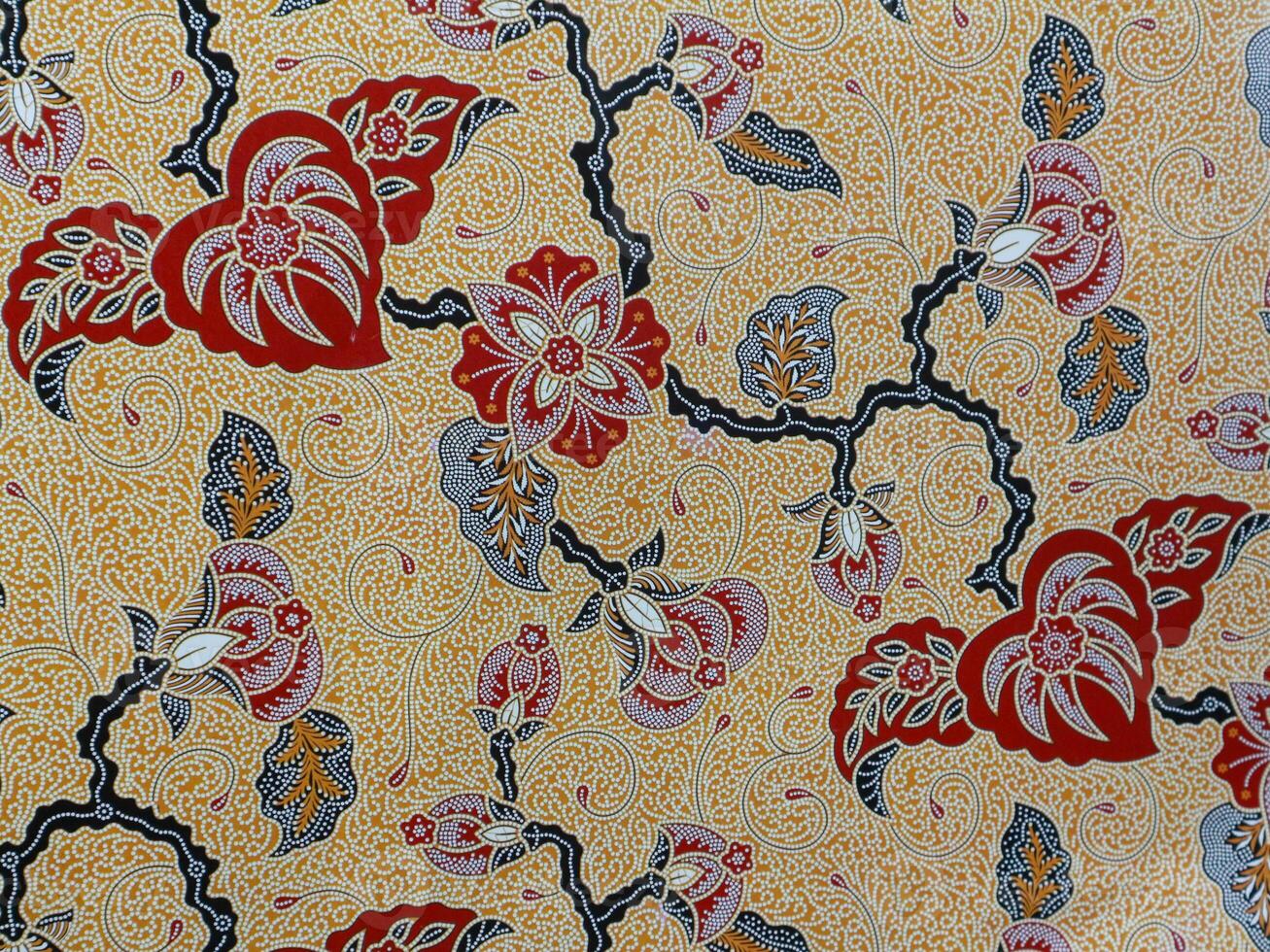 The beautiful red and brown of art Indonesian Batik Pattern, leaf and flowers pattern fabric photo