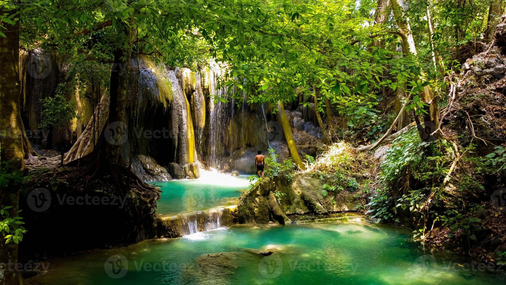 Deep forest waterfall at Mata Jitu Waterfall In Moyo Island, Sumbawa, Indonesia photo
