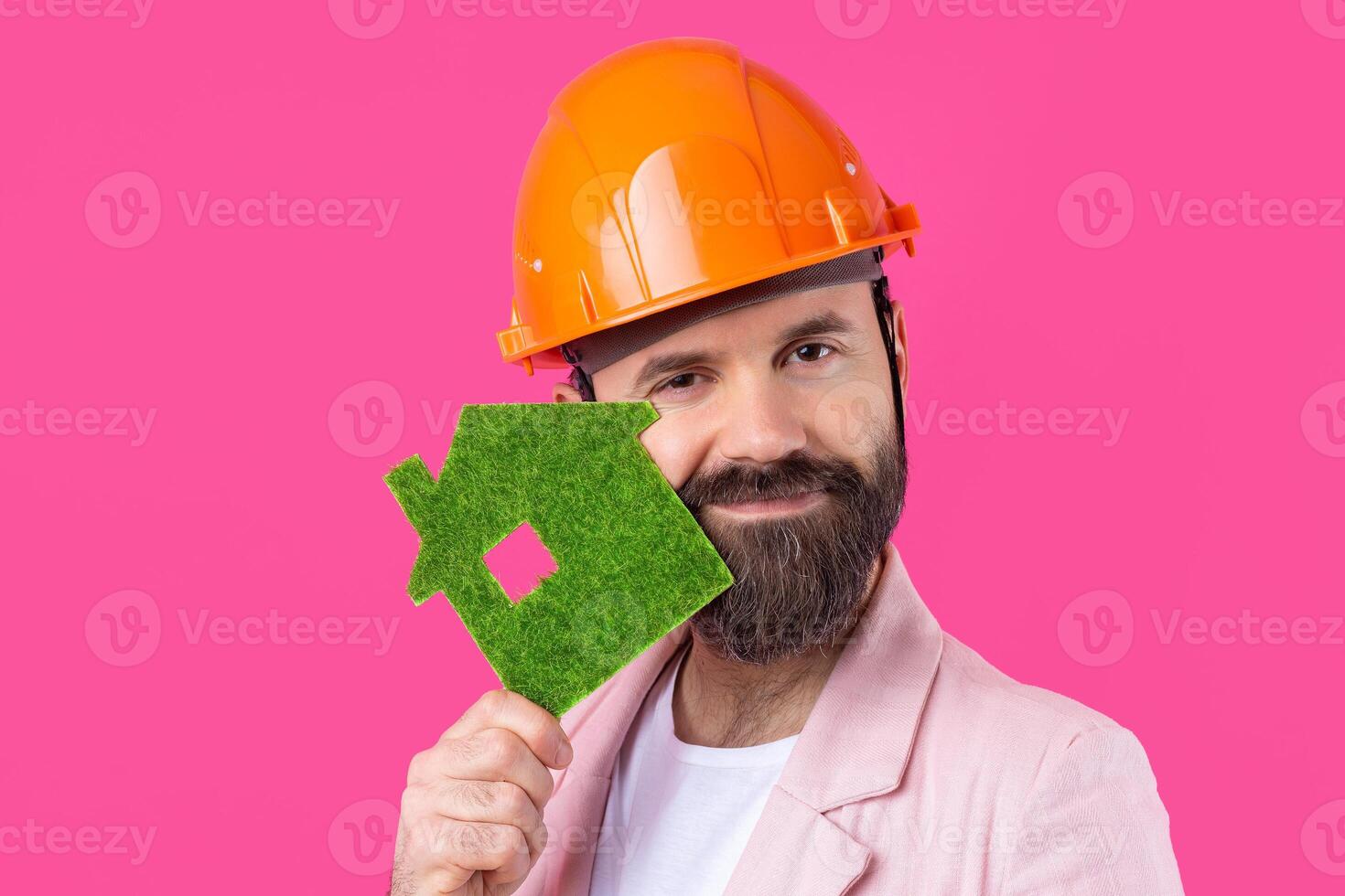 Portrait of young construction engineer wear orange hard hat, in a pink jacket. photo