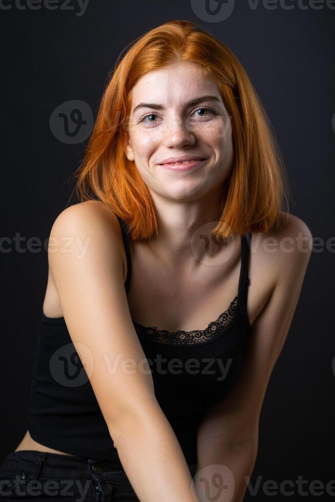 Cute red-haired girl, studio portrait photo
