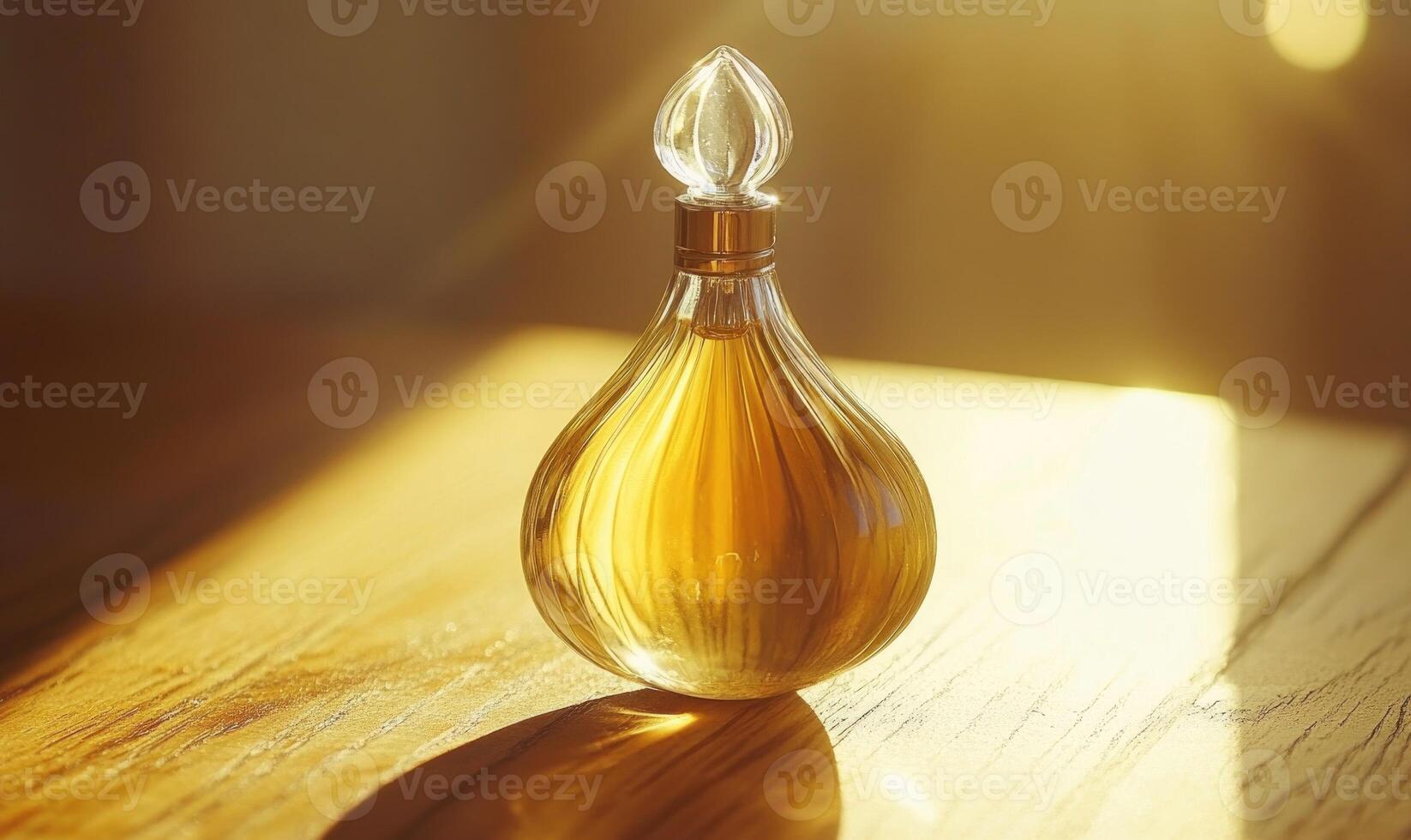 A bottle of perfume is sitting on a wooden table photo
