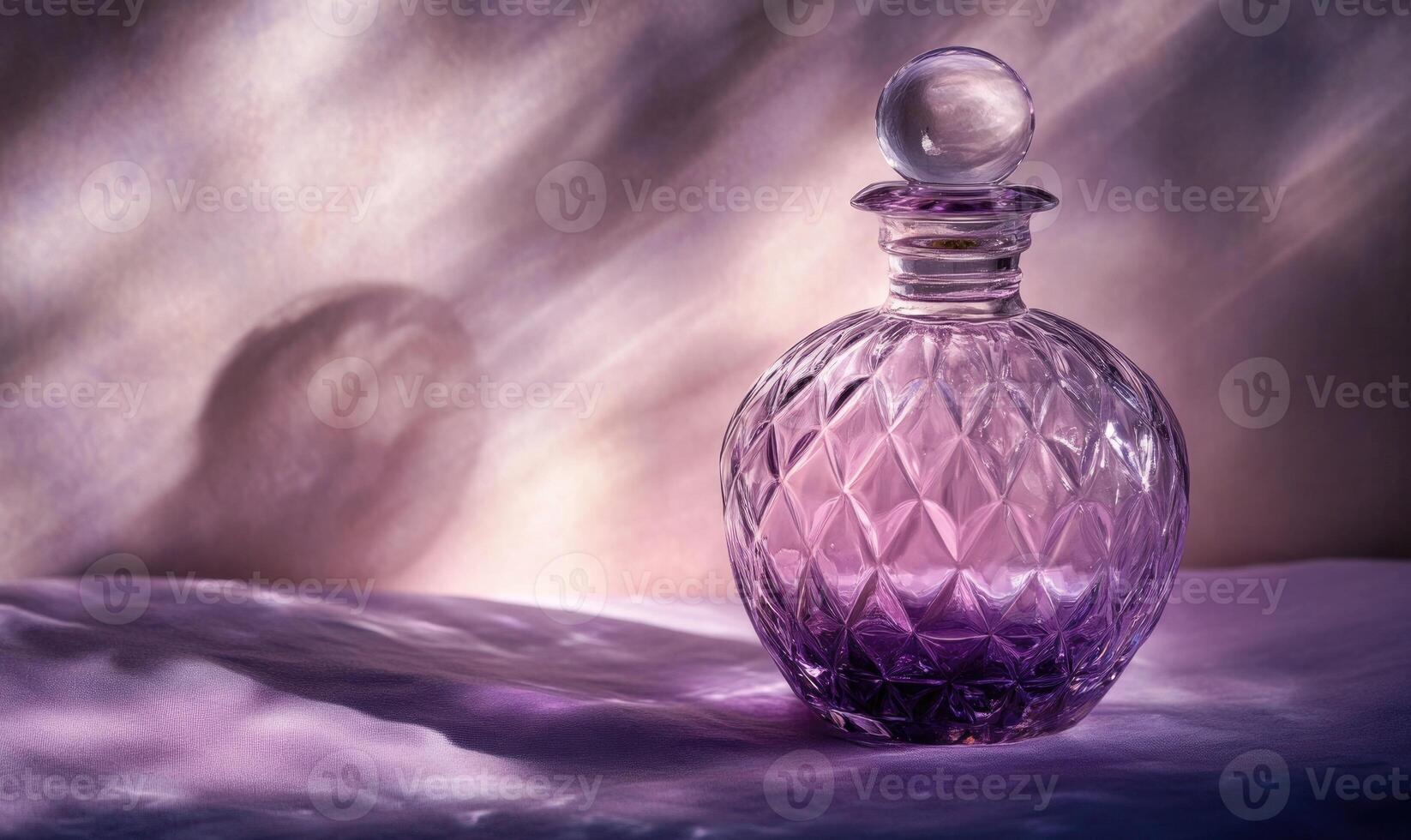 A purple glass perfume bottle with a clear top photo