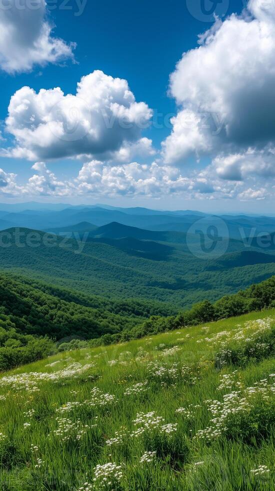 Rolling hills leading to mountain range on distant horizon , wallpaper art photo