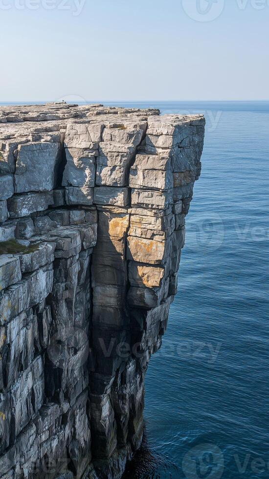 Rock platform extending from cliff base into the sea , wallpaper art photo