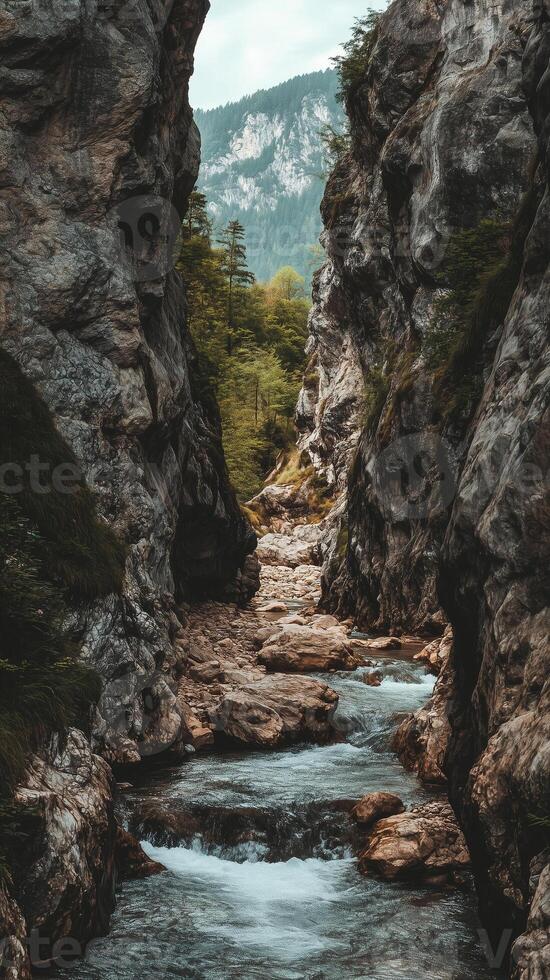 Stream descending between cliff walls toward a basin , photorealistic photo