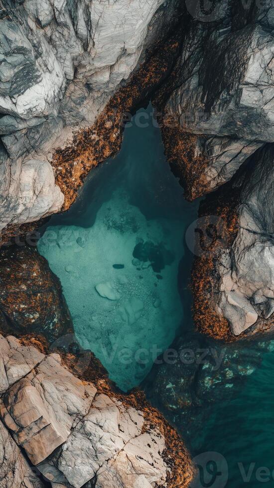 Tide pools between rocks along the shoreline, wallpaper art photo