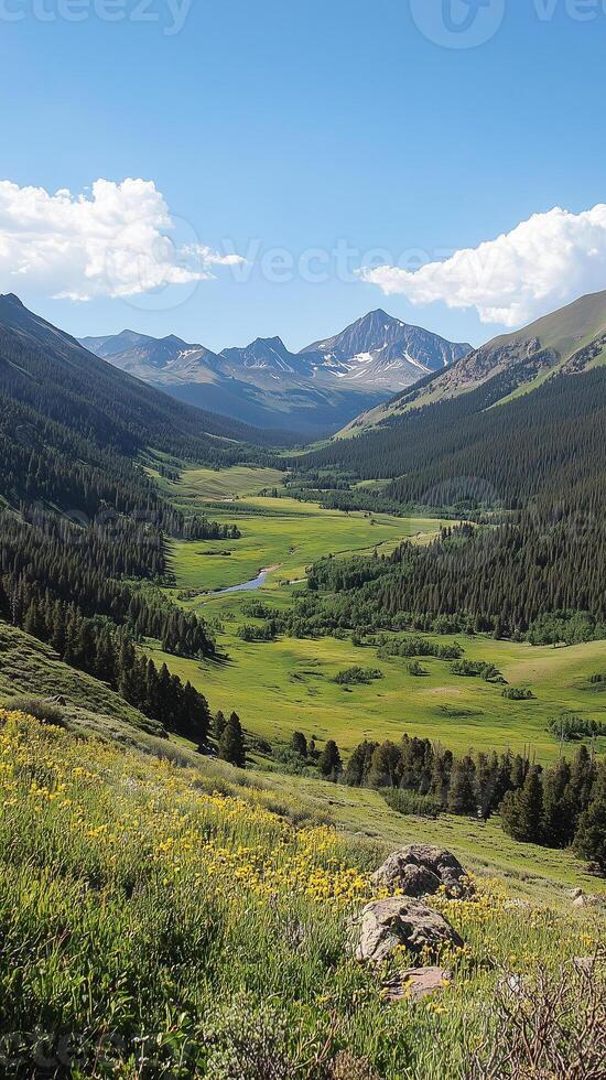 Valleys curve between ridges toward peaks in the background vista, wallpaper art photo