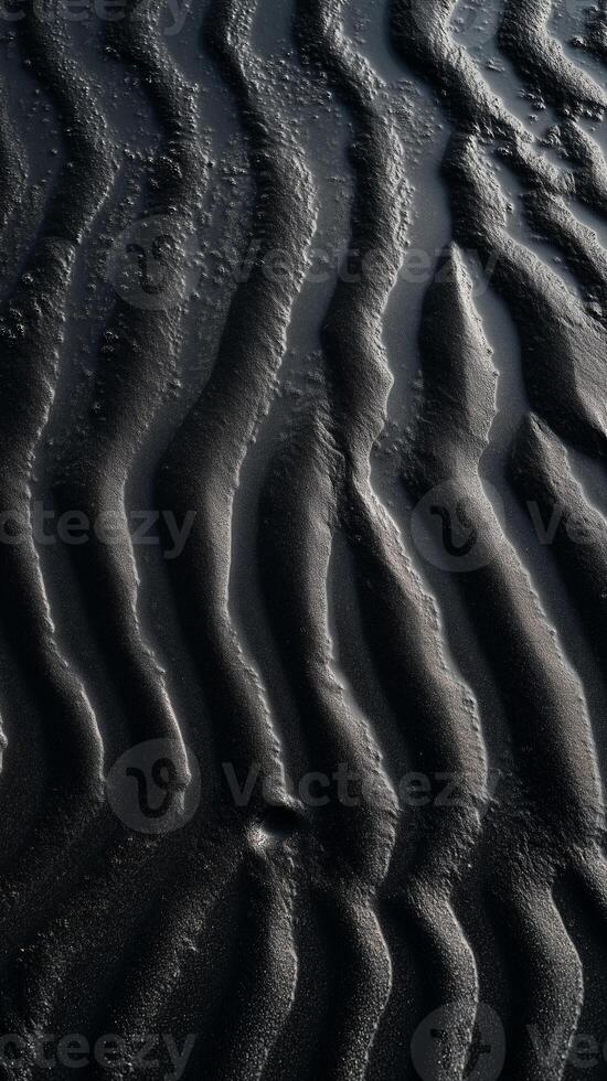 Waves break on shore creating patterns in sand, wallpaper photo