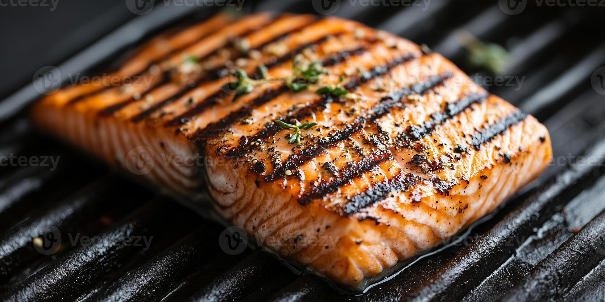 Close-up of grilled salmon fillet with seasoning and grill marks, culinary photography photo