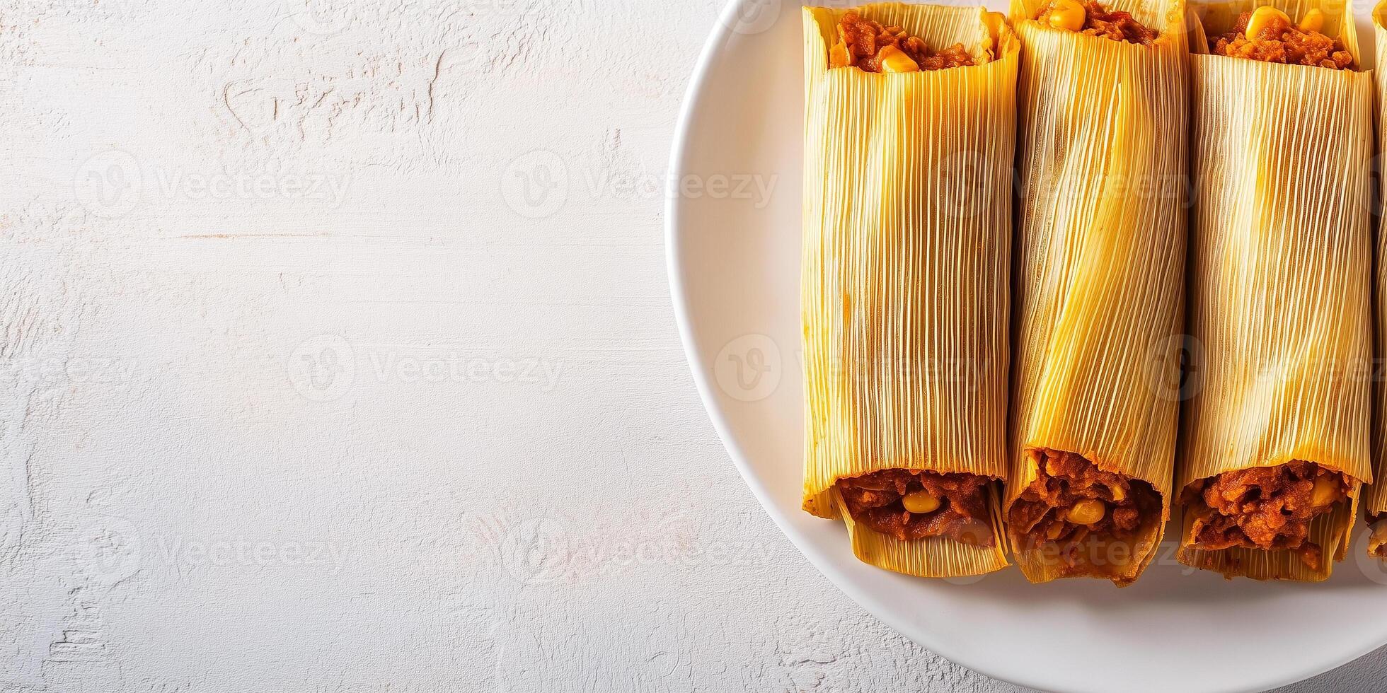 Row of tamales with corn husks partially opened, revealing the filling, on a plain white plate, culinary photography photo