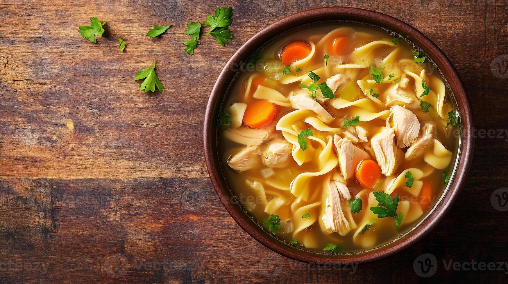 Bowl of chicken noodle soup with submerged chicken, noodles, and vegetables, meal photography photo