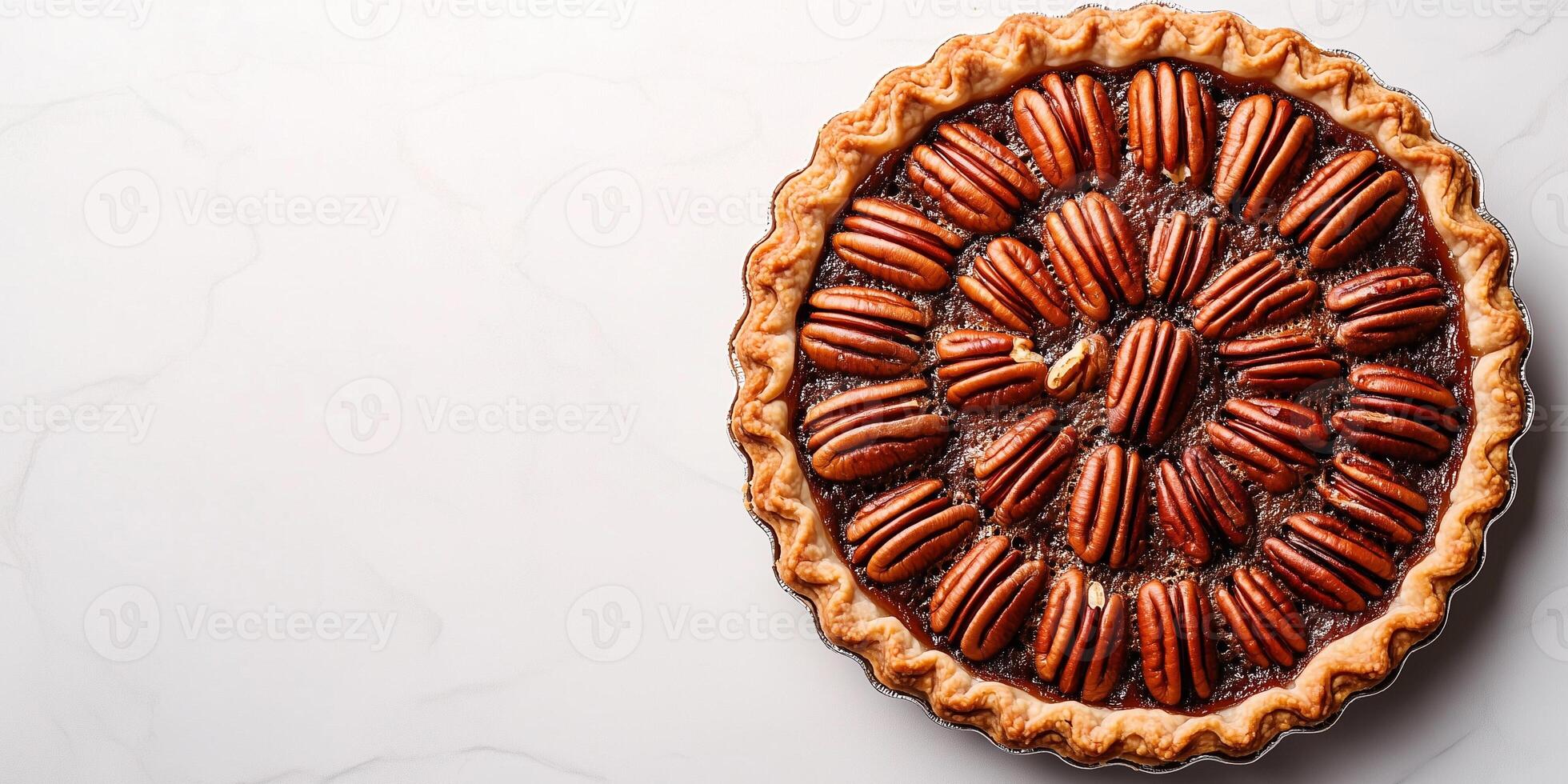 Pecan pie with a glossy top, filled with whole pecans arranged in a circular pattern, food setting photo