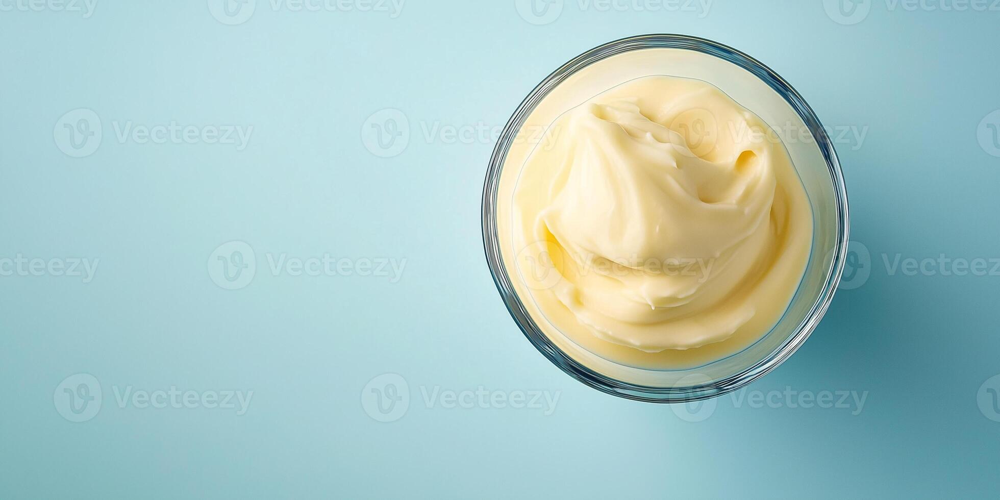 Portion of spread in a clear glass with a smooth, even surface, meal photography photo