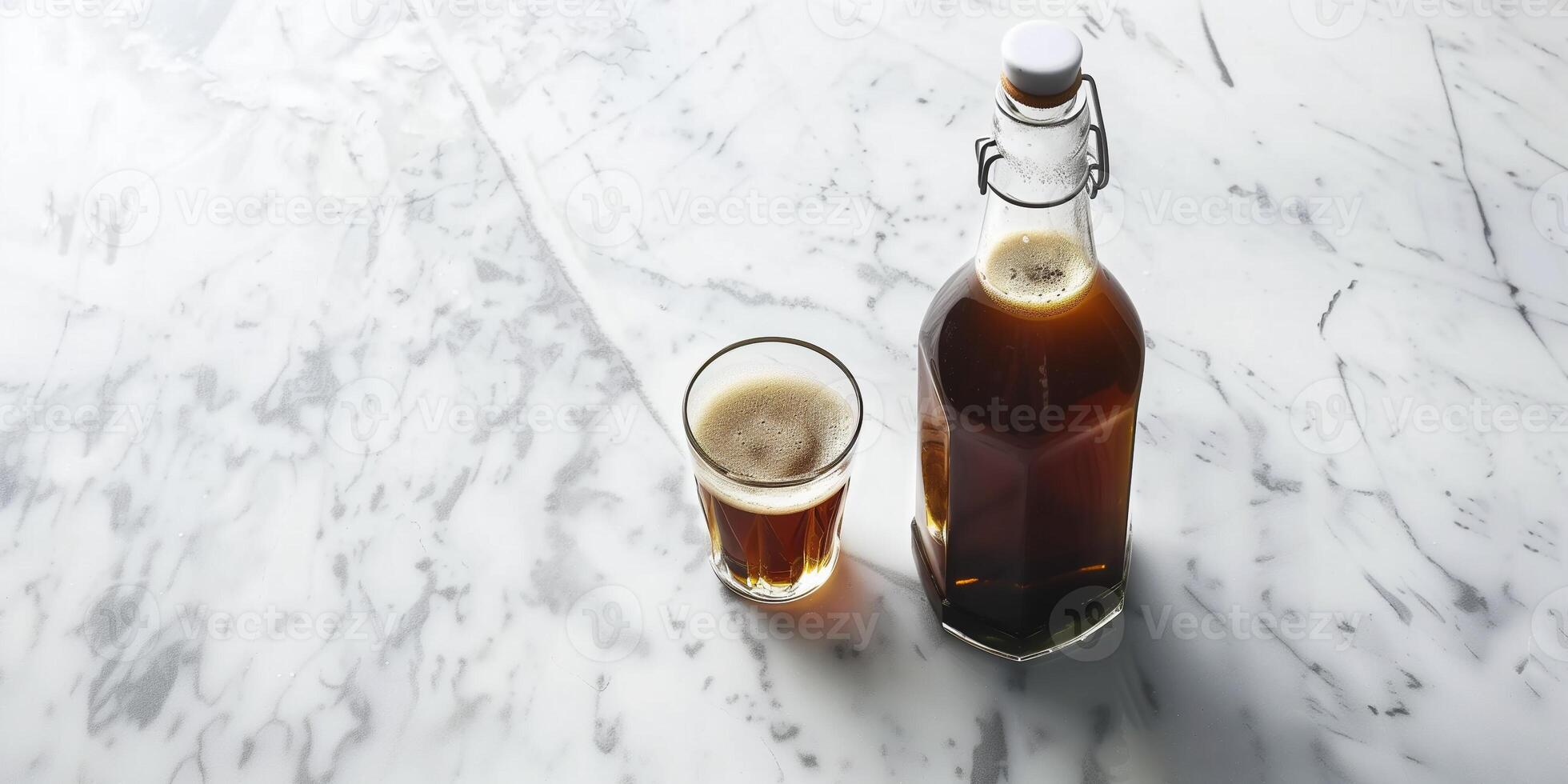 Nitro coffee in a glass bottle on a marble countertop with a small glass beside it, culinary photography photo