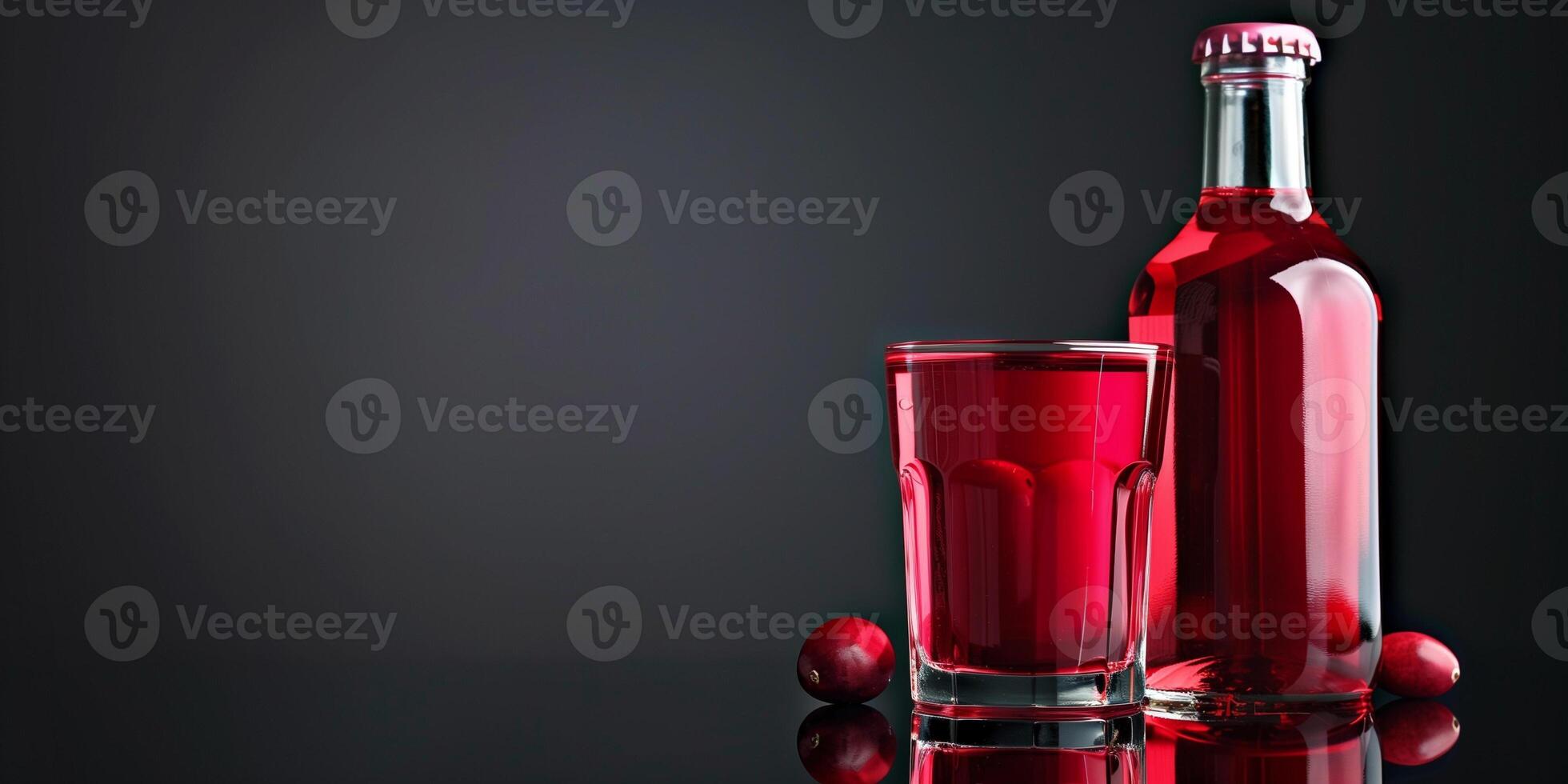 Transparent glass of cranberry-flavored cider, next to its bottle, placed on a reflective surface, food photography photo