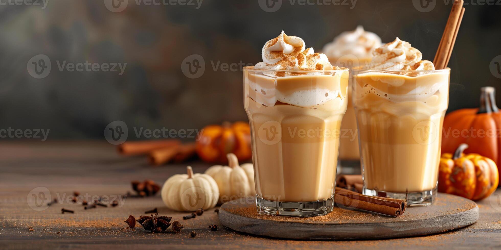 Multiple pumpkin spice latte glasses arranged with visible cinnamon sticks and small decorative pumpkins, gastronomy photography photo