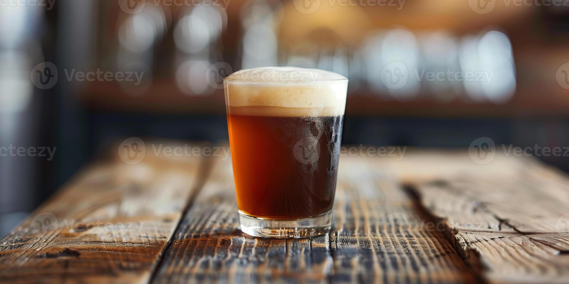 Nitro coffee in a clear cup with foam on top, on a wooden table, photorealistic food photo