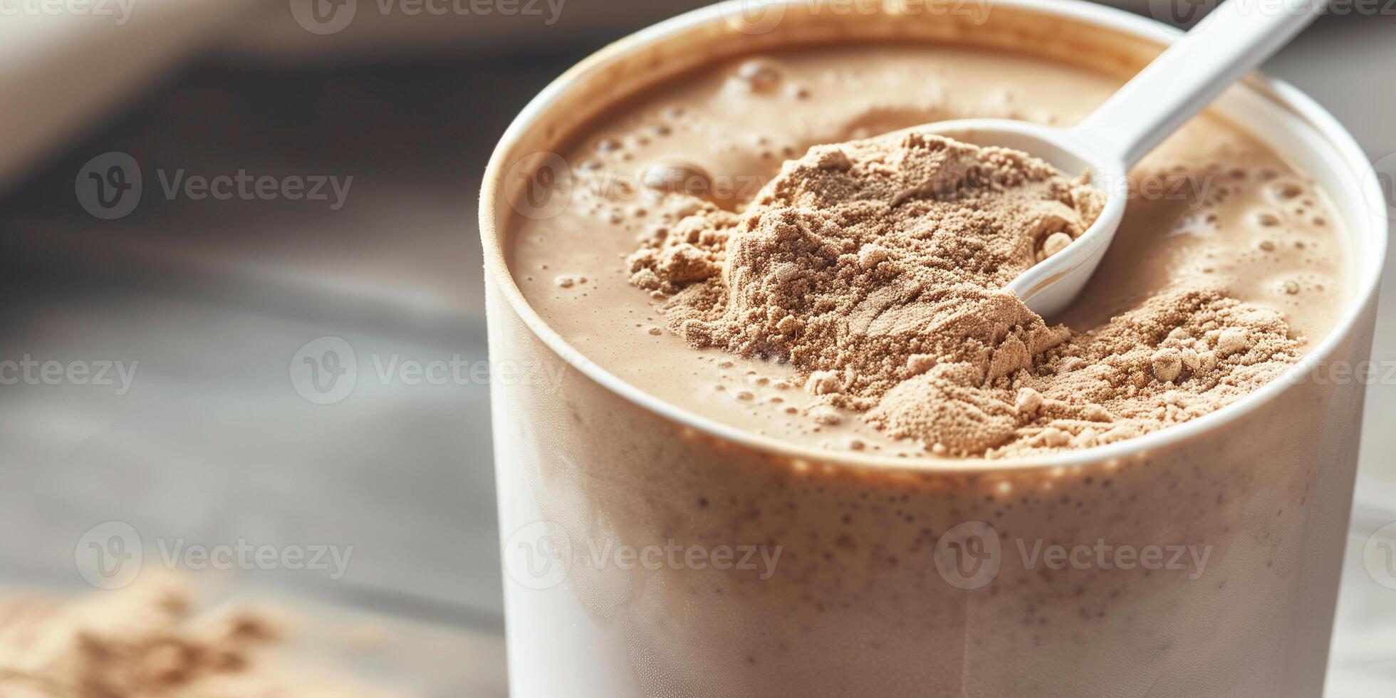 Nutritional drink mix in a large container with the serving scoop visible inside, food setting photo