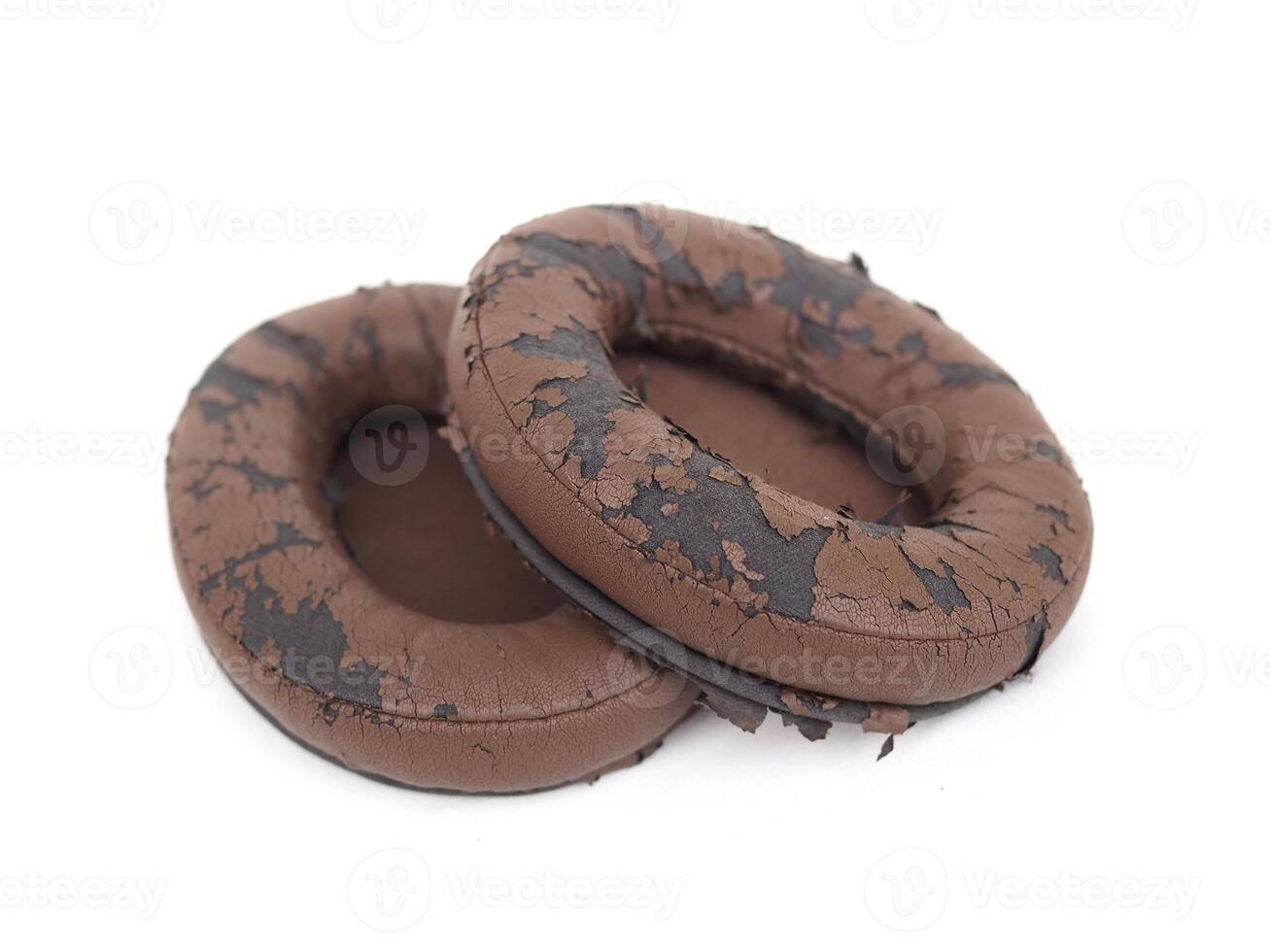 broken headphone pad from frequent use isolated on a white background photo