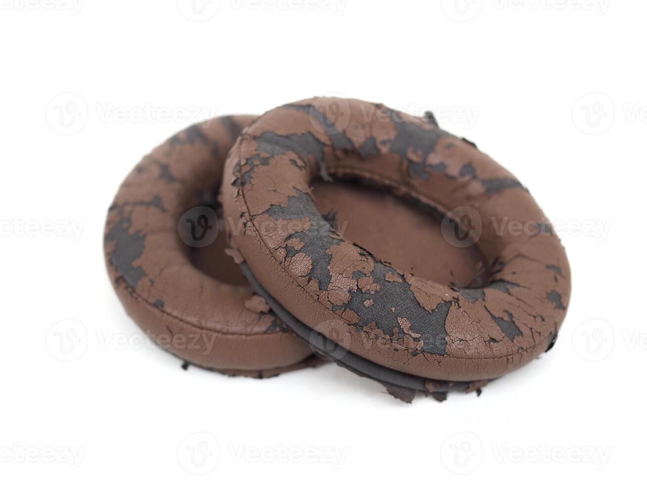 broken headphone pad from frequent use isolated on a white background photo