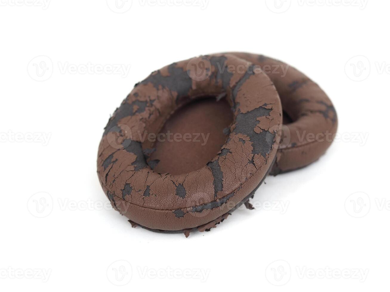 broken headphone pad from frequent use isolated on a white background photo