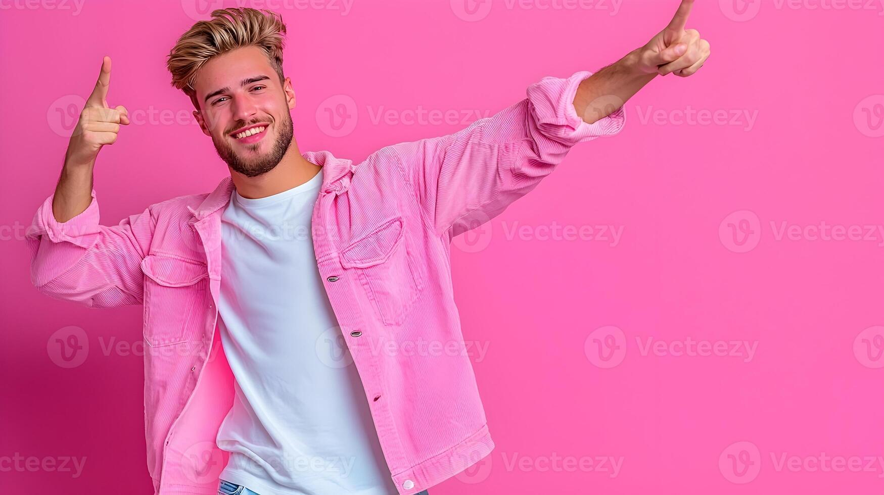 Energetic Man Expressing Excitement in Dab Pose on Pink Background photo