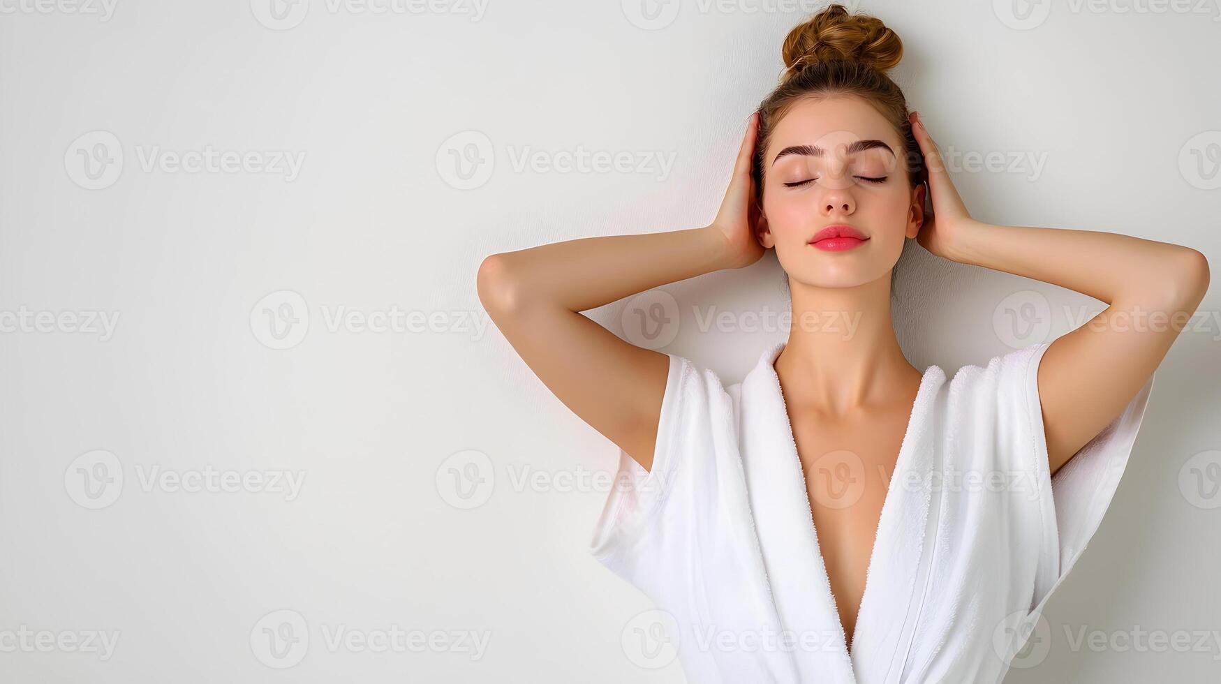 Radiant Woman in Soft Spa Robe Enjoying Peaceful Relaxation on White Background photo