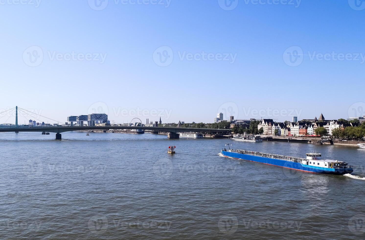 View at the Rhine in Cologne in Germany in fine weather with the famous buildings of the skyline in the background. photo