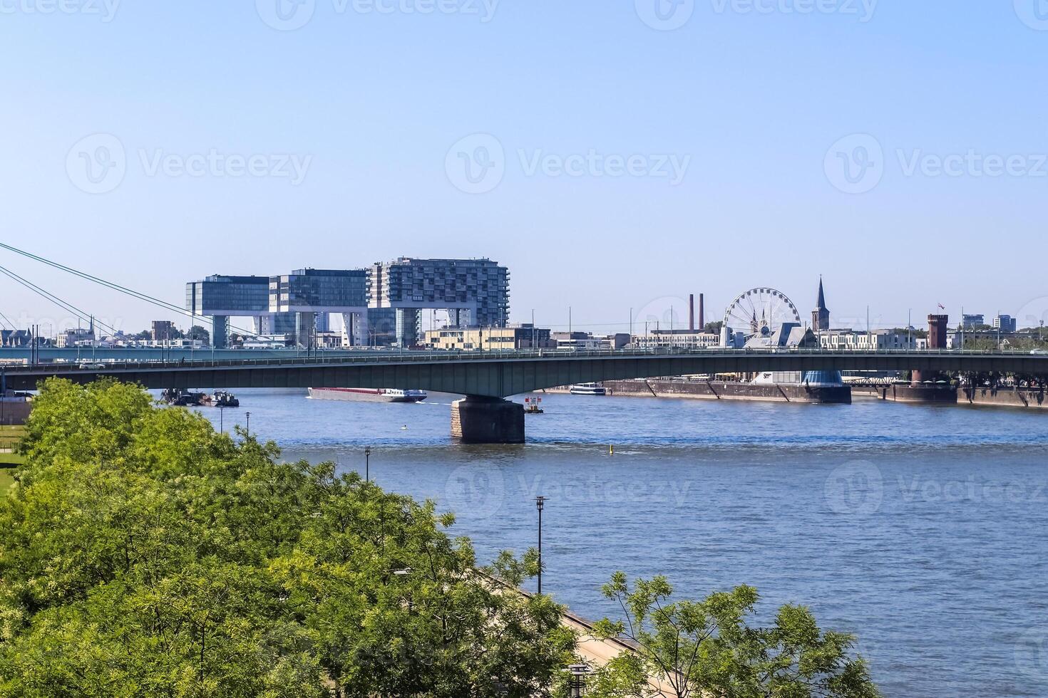 View over the Rhine in Cologne in Germany at fine weather with the famous buildings of the skyline in the background. photo