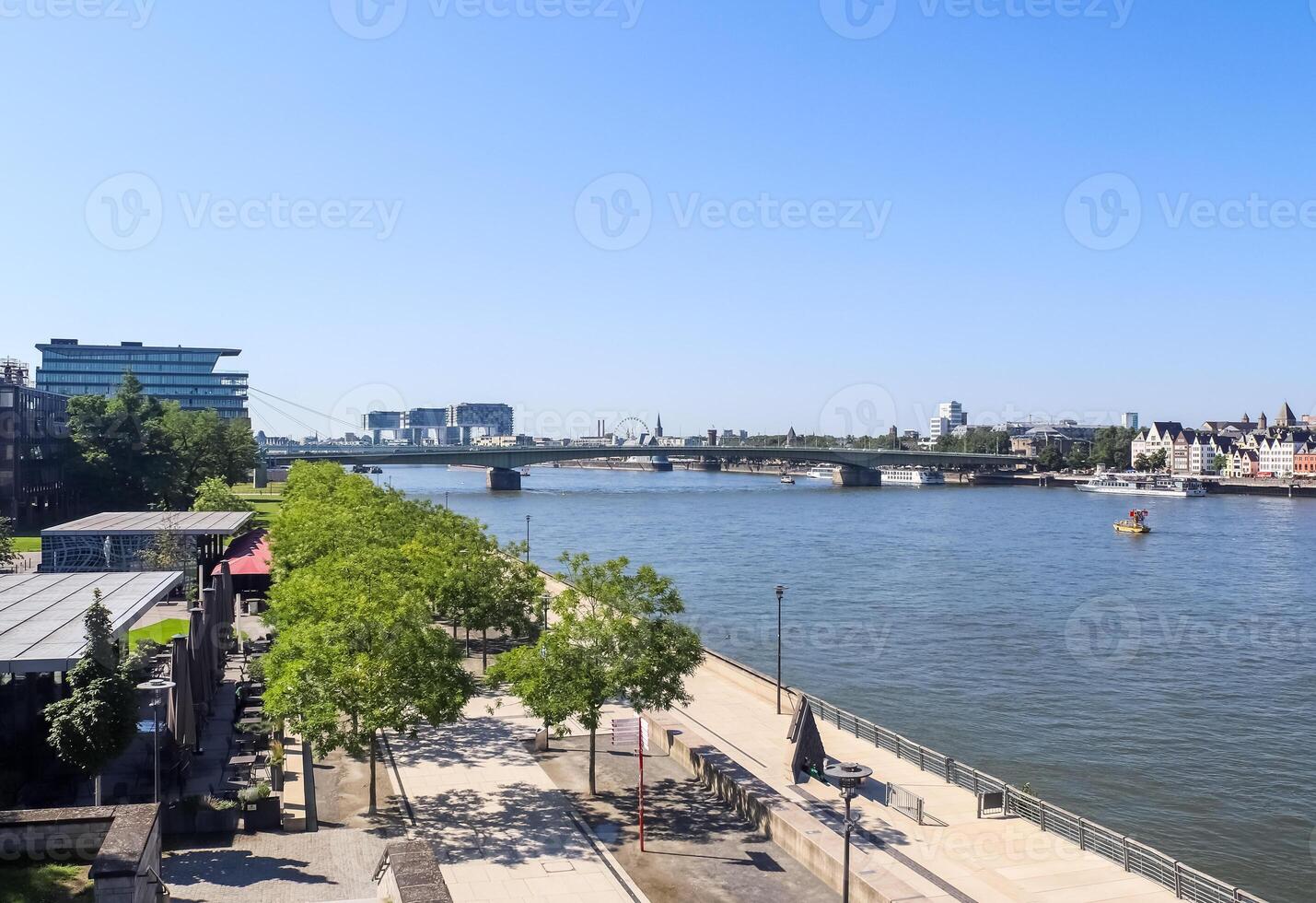 View over the Rhine in Cologne in Germany in fine weather with the famous buildings of the skyline in the background. photo
